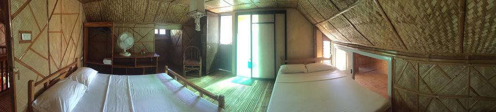 פוארטו גאלרה Bamboo House Beach Lodge & Restaurant מראה חיצוני תמונה